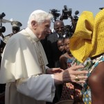 Pope Benedict XVI is greeted as he arrives at the Bernardin Gantin airport in Cotonou